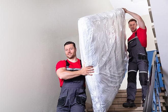 mattress and box spring being removed for renovation in Seaford